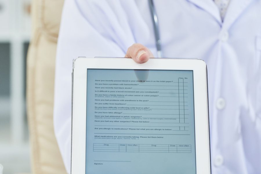 Anamnesis Doctor giving tablet computer with survey to get anamnesis